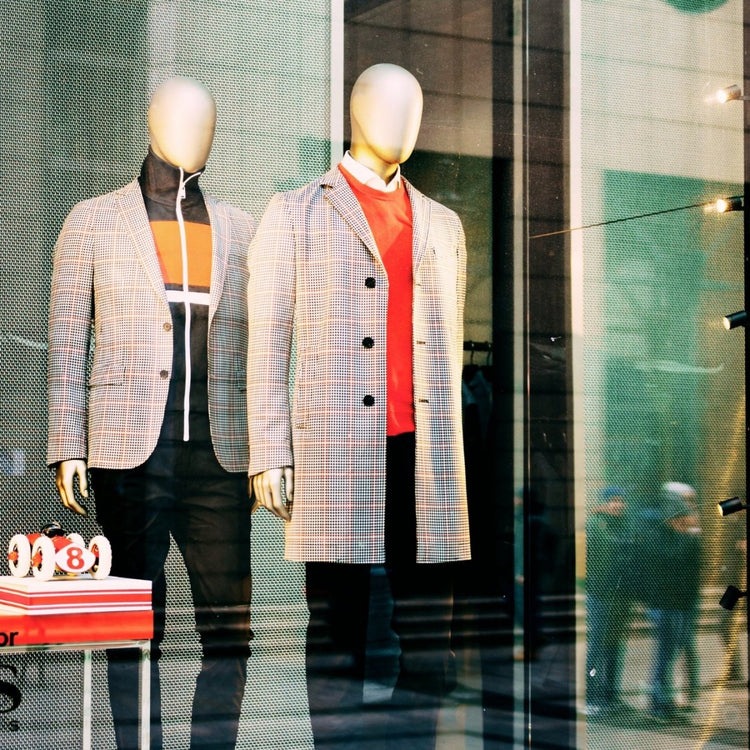 Various men's jackets and coats, including a trench coat, a bomber jacket, a wool overcoat, and a puffer jacket.