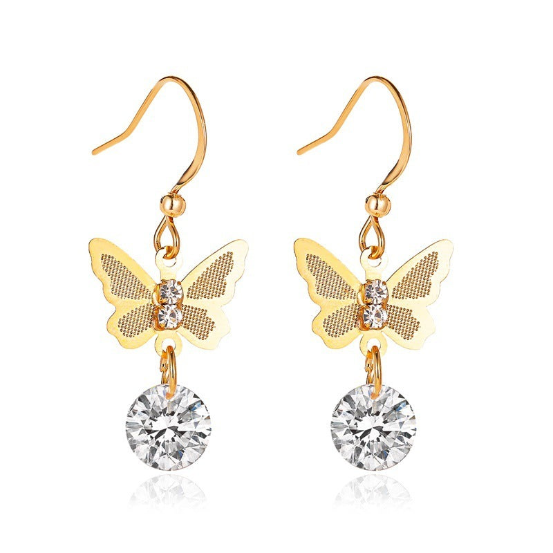 Gold butterfly drop earring with faceted crystal
