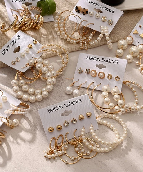 Gold hoop and stud earring set with faux pearls and crystals — 6 pairs on card.