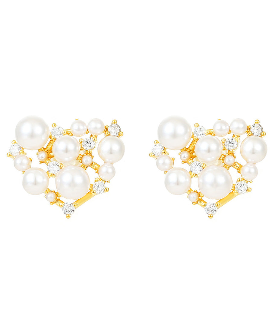 Heart-shaped pearl earrings with gold accents on a white background