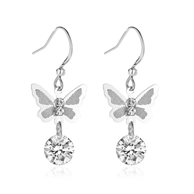 Silver butterfly drop earring with faceted crystal